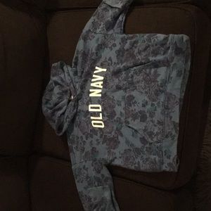 A blue old navy sweatshirt .